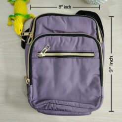 Nylon multi-pocket cross-body bag with gold zippers