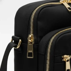 Nylon multi-pocket cross-body bag with gold zippers