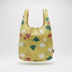 reusable foldable shopping bag with gold print, shown with matching compact pouch.